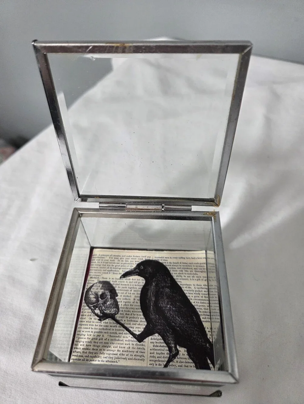 Decorative glass and metal keepsake box gothic-style a Rave and a human skull